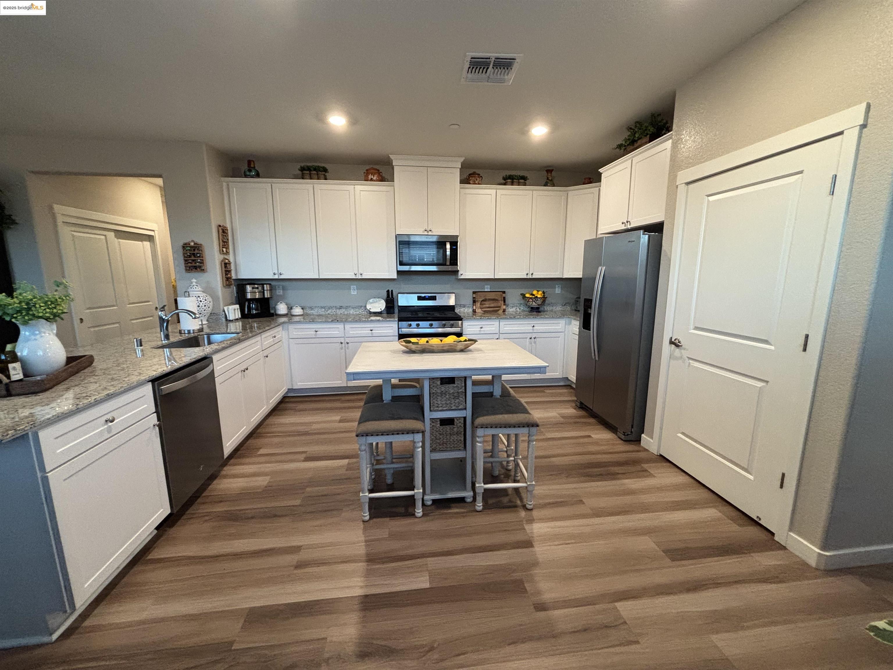 2107 Lavender Place Rio Vista, CA 94571 - Photo 12 of 45 a kitchen with stainless steel appliances a refrigerator stove microwave and cabinets