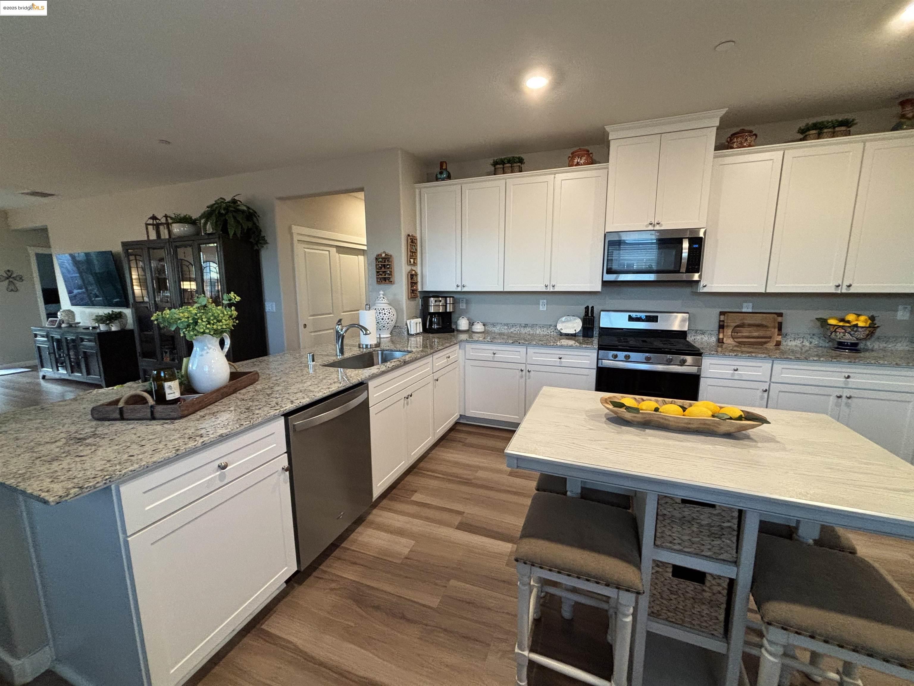 2107 Lavender Place Rio Vista, CA 94571 - Photo 13 of 45 a kitchen with a stove a sink and a refrigerator