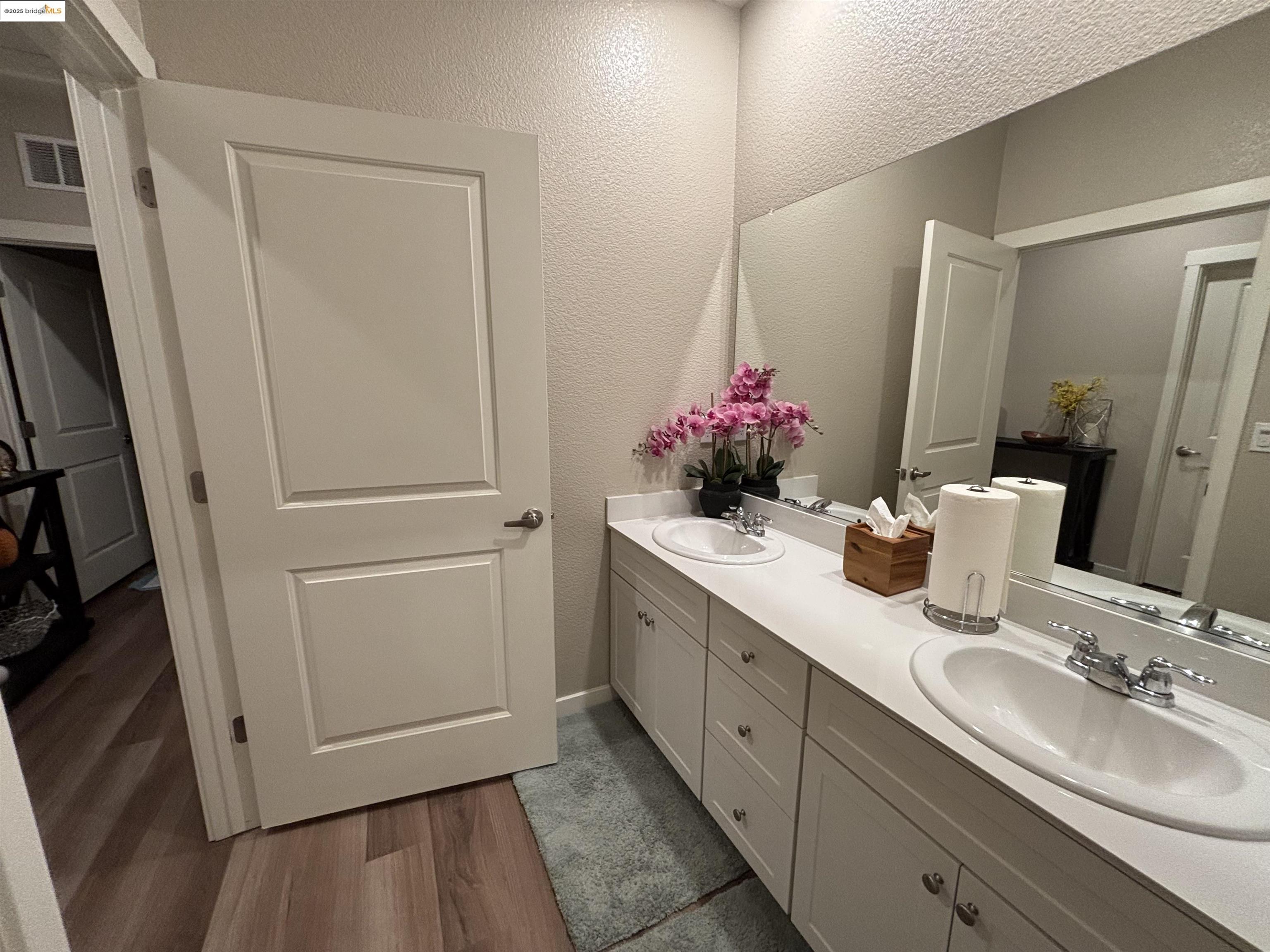 2107 Lavender Place Rio Vista, CA 94571 - Photo 24 of 45 a bathroom with a granite countertop sink a mirror and a shower