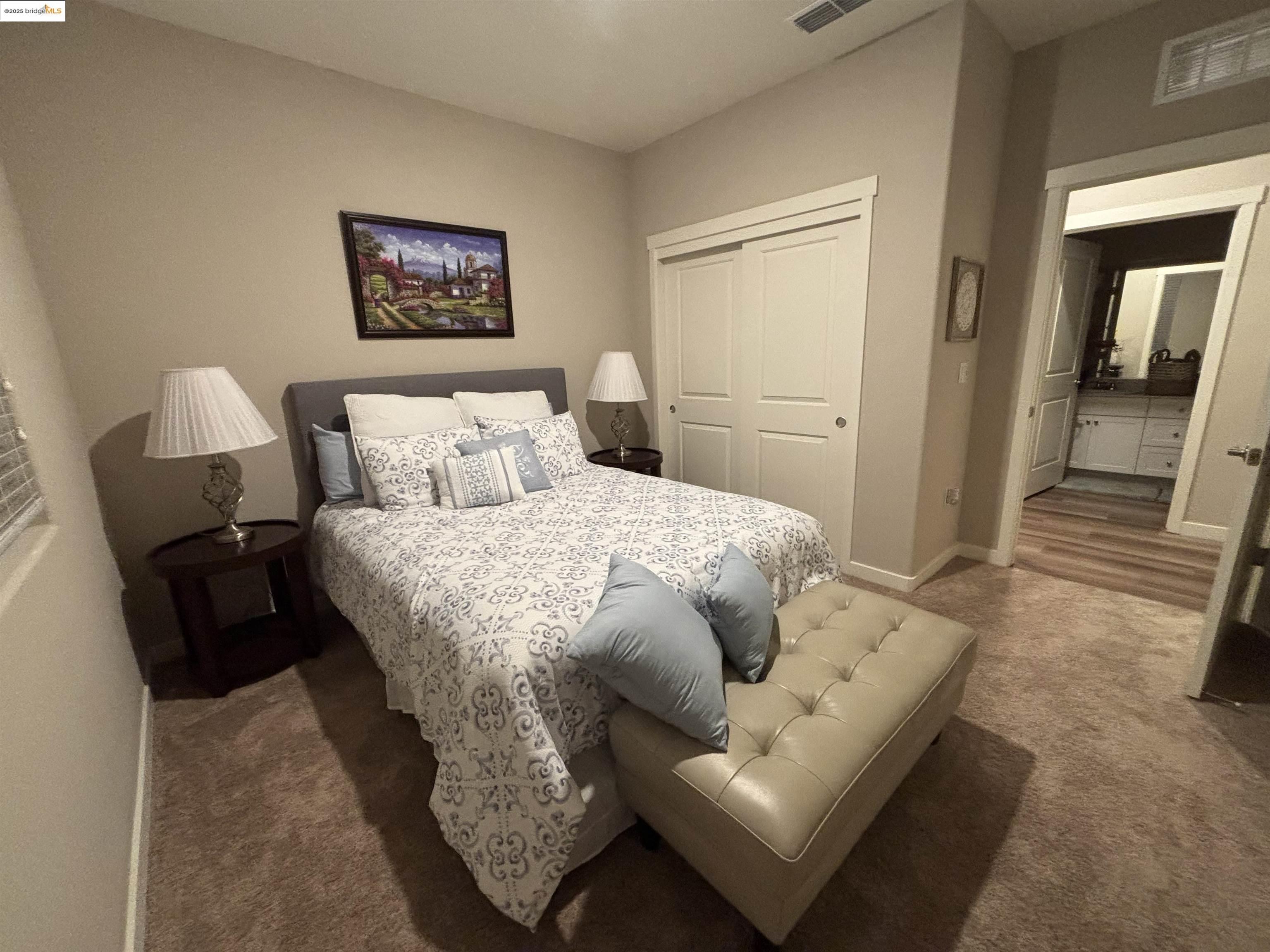 2107 Lavender Place Rio Vista, CA 94571 - Photo 26 of 45 a bedroom with a bed and a couch