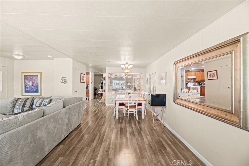 2964 Silver Oak Way Hemet, CA 92545 - Photo 14 of 60 a living room with furniture and a wooden floor