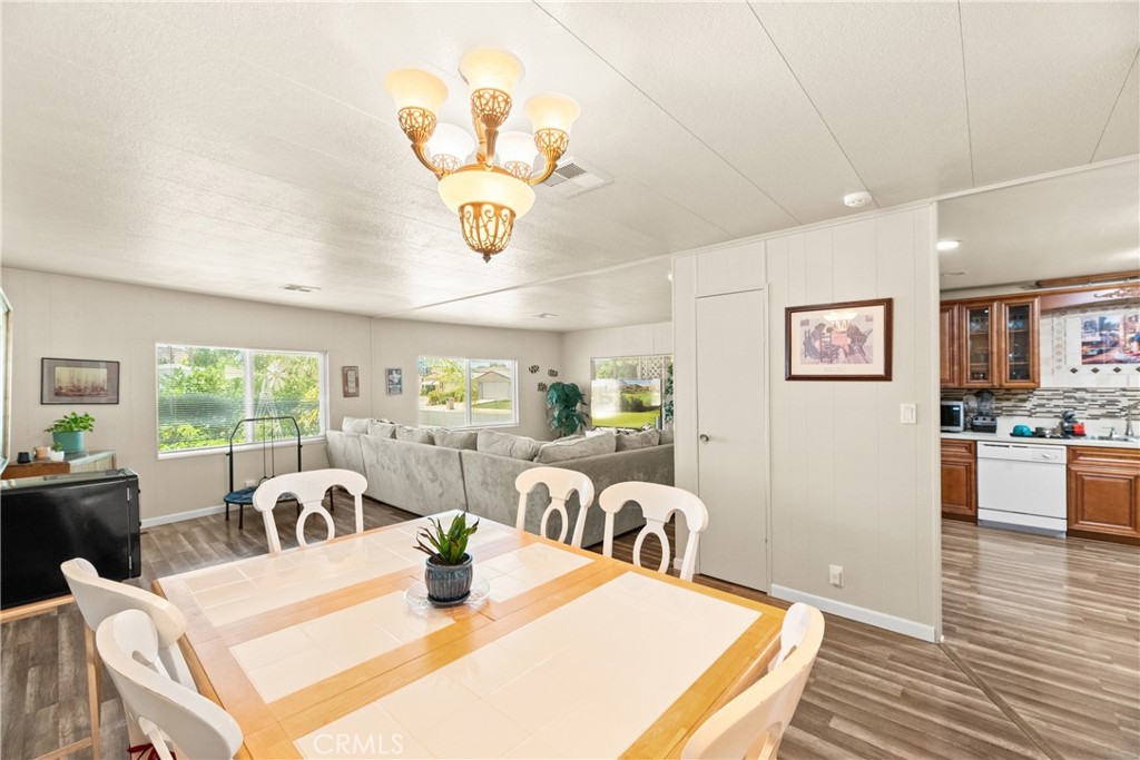 2964 Silver Oak Way Hemet, CA 92545 - Photo 18 of 60 a view of a dining room with furniture window and outside view