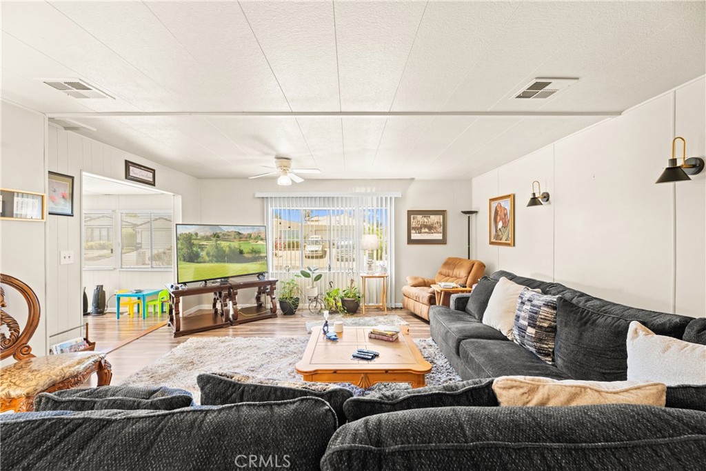 2964 Silver Oak Way Hemet, CA 92545 - Photo 27 of 60 a living room with furniture window and wooden floor