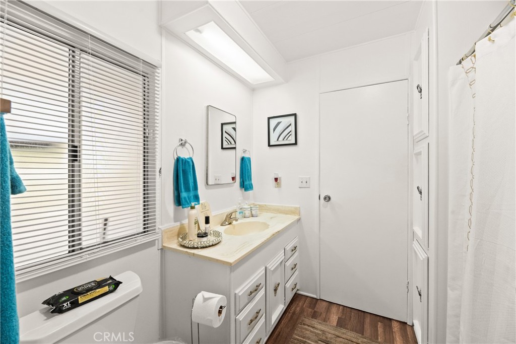 2964 Silver Oak Way Hemet, CA 92545 - Photo 40 of 60 a bathroom with a sink a mirror and a window