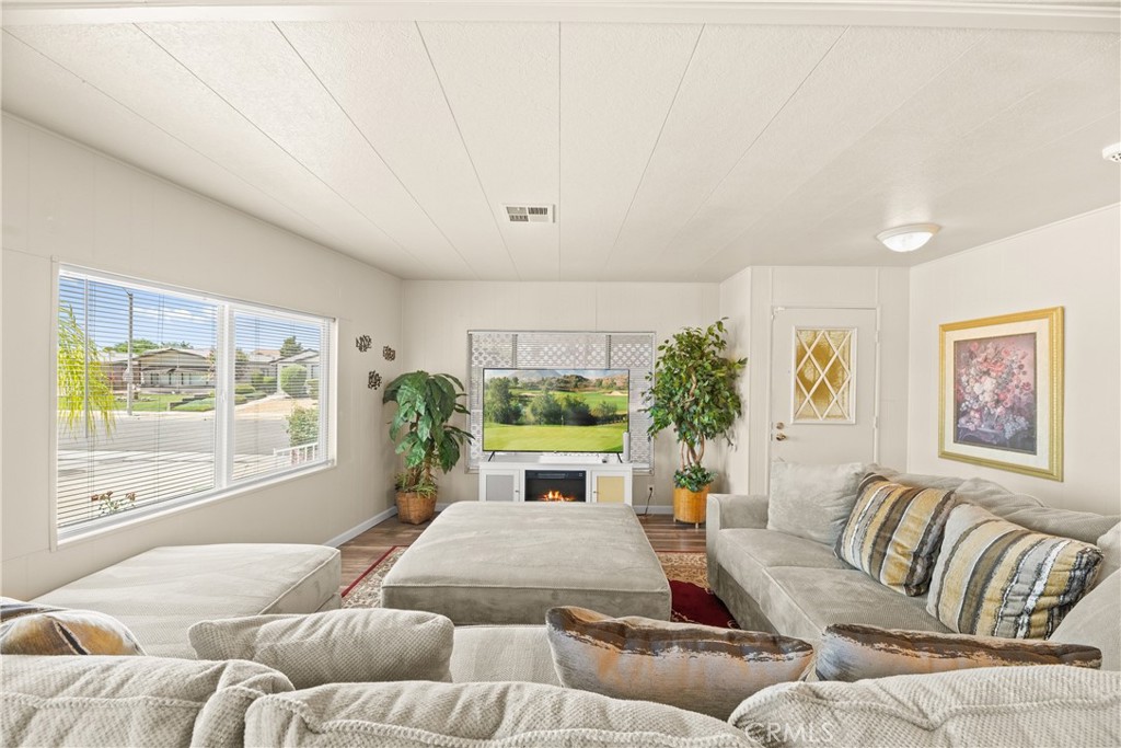 2964 Silver Oak Way Hemet, CA 92545 - Photo 4 of 60 a living room with furniture fireplace and window