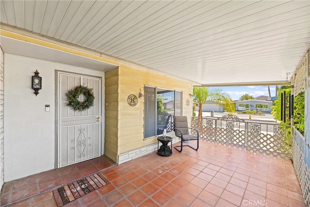 2964 Silver Oak Way Hemet, CA 92545 - Photo 49 of 60 a view of a hallway with couch and chandelier