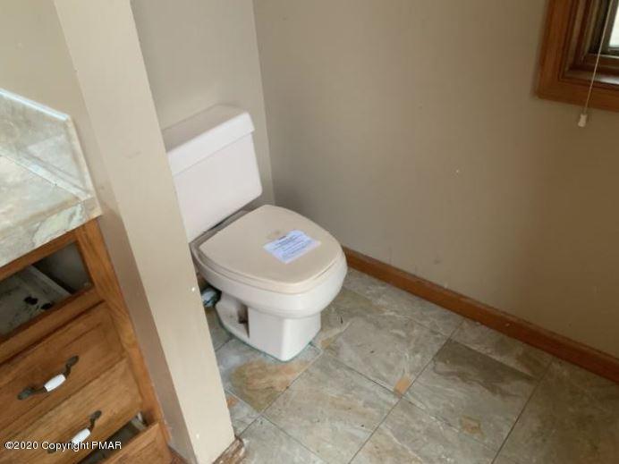400 Blue Ridge Road Saylorsburg, PA 18353 - Photo 11 of 13 a white toilet sitting next to a sink