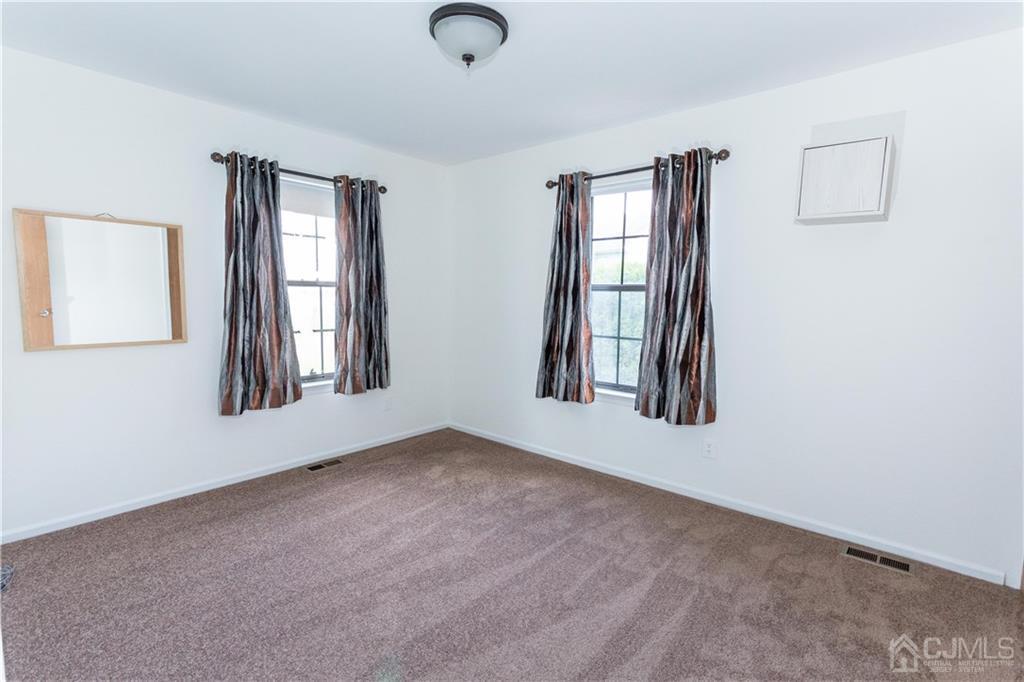 3301 Stonehedge Road, Unit 3301 Edison, NJ 08820 - Photo 22 of 25 an empty room with windows