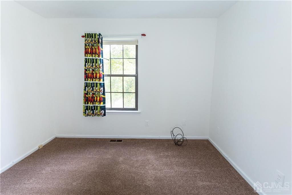 3301 Stonehedge Road, Unit 3301 Edison, NJ 08820 - Photo 23 of 25 a room with a window