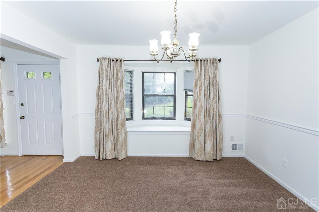 3301 Stonehedge Road, Unit 3301 Edison, NJ 08820 - Photo 7 of 25 a view of an empty room with window