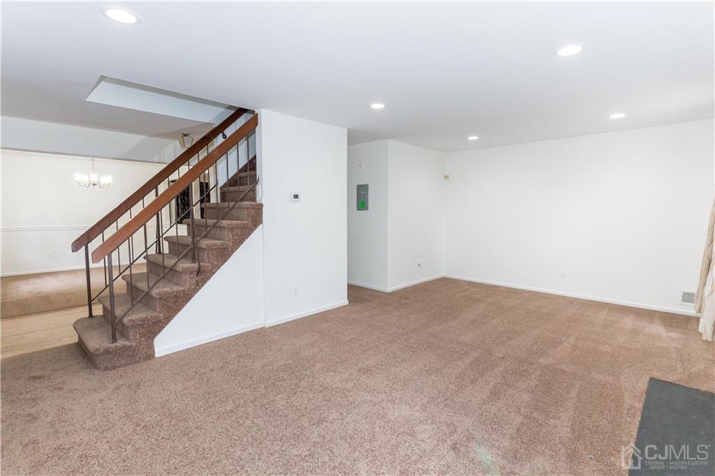 3301 Stonehedge Road, Unit 3301 Edison, NJ 08820 - Photo 8 of 25 a view of an empty room with stairs
