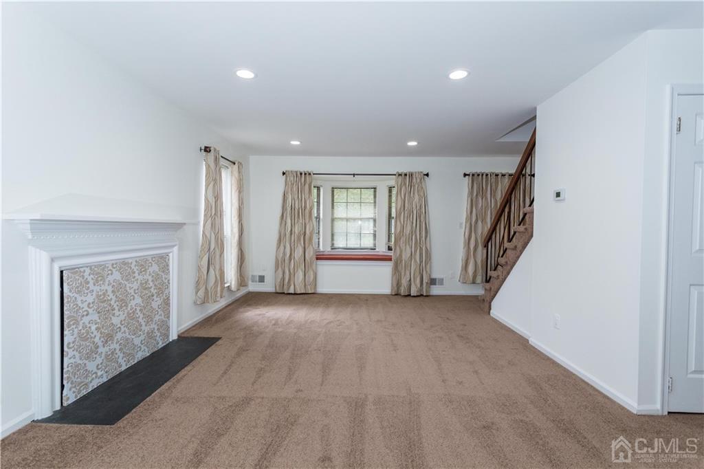 3301 Stonehedge Road, Unit 3301 Edison, NJ 08820 - Photo 10 of 25 a view of livingroom with furniture and stairs
