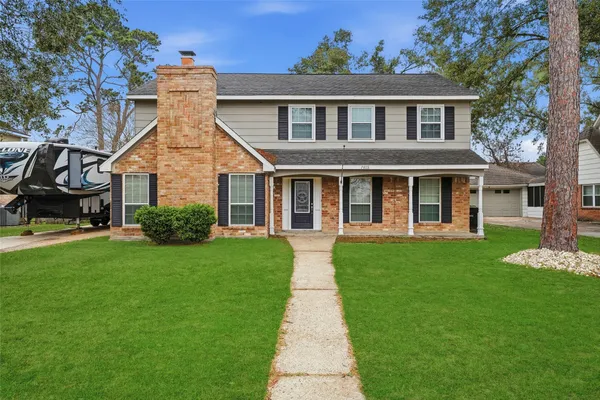 front view of a house with a yard