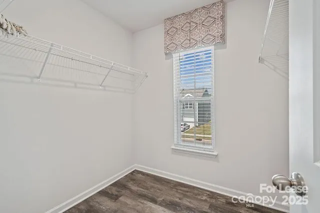 a view of a small space with racks on the wall