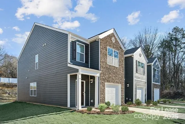 a front view of a house with yard