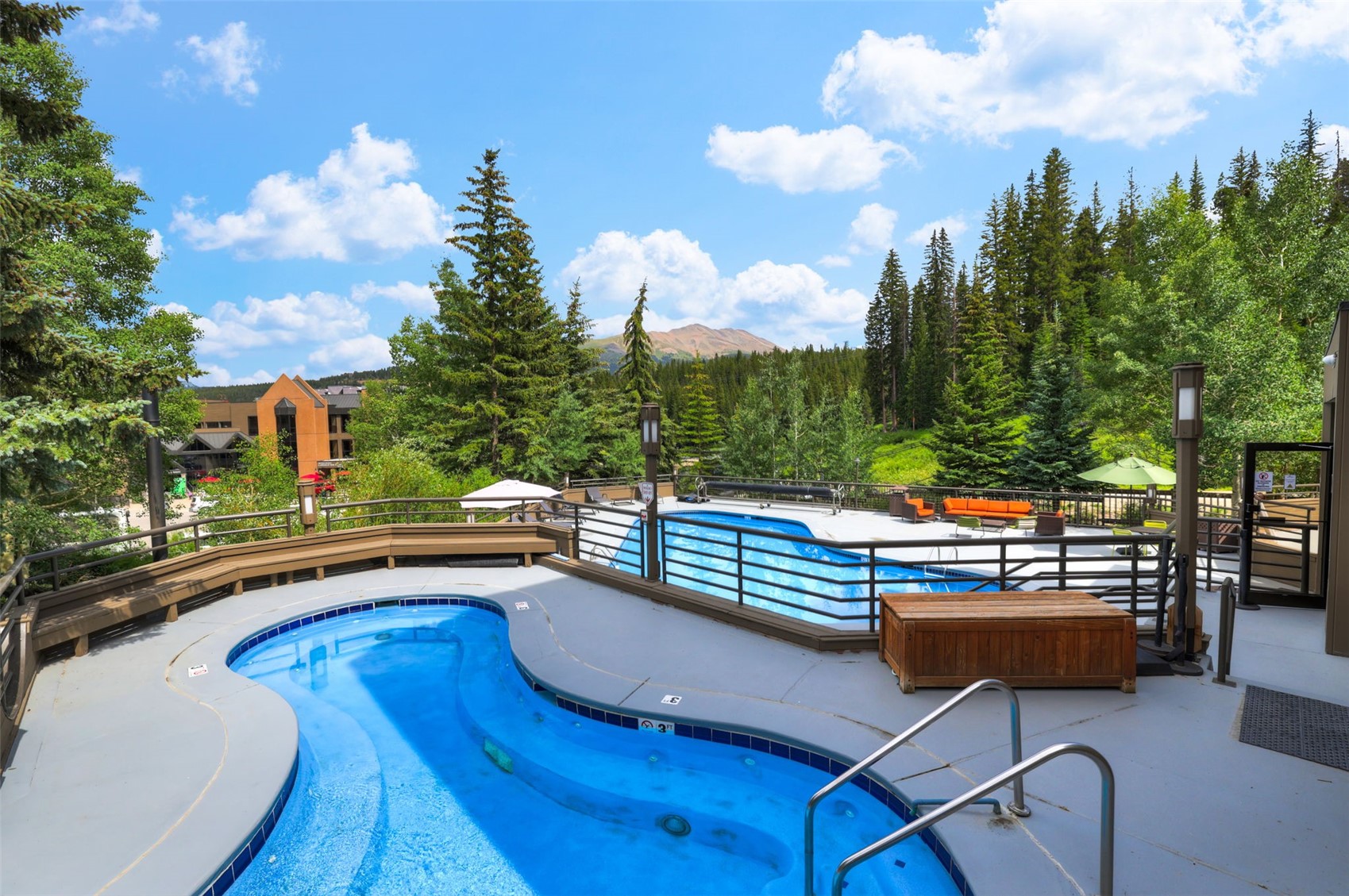 631 Village Road, Unit 31460 Breckenridge, CO 80424 - Photo 11 of 20 a view of swimming pool with seating area and barbeque oven