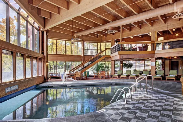 a view of a swimming pool with a patio