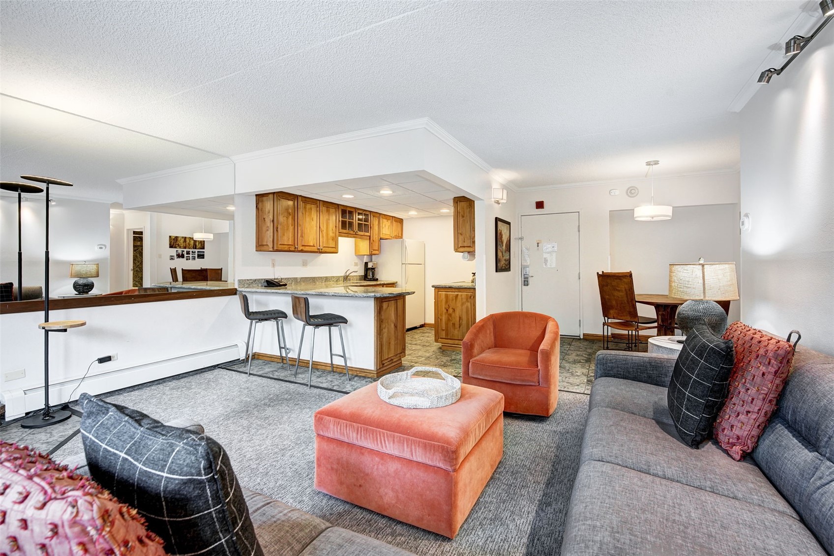 631 Village Road, Unit 31460 Breckenridge, CO 80424 - Photo 3 of 20 a living room with furniture and a flat screen tv