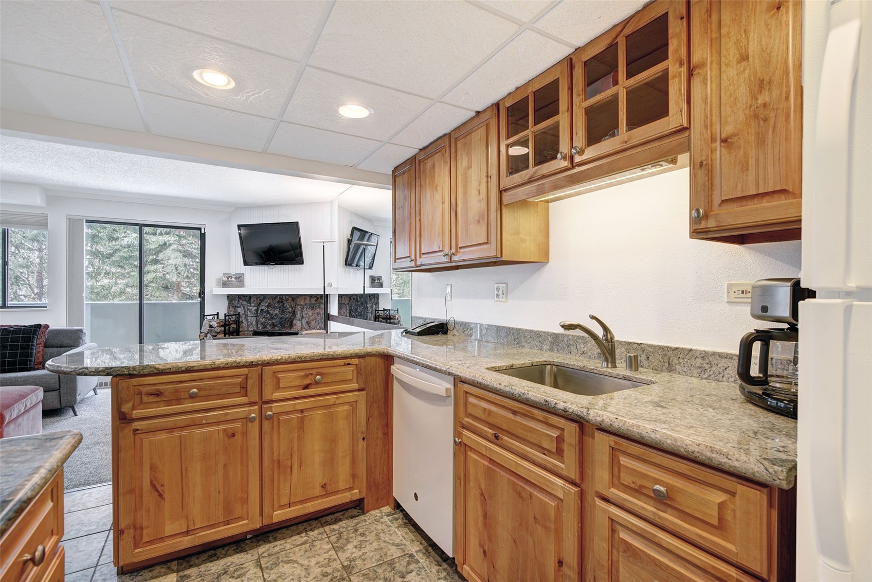 631 Village Road, Unit 31460 Breckenridge, CO 80424 - Photo 6 of 20 a kitchen with granite countertop a sink and cabinets