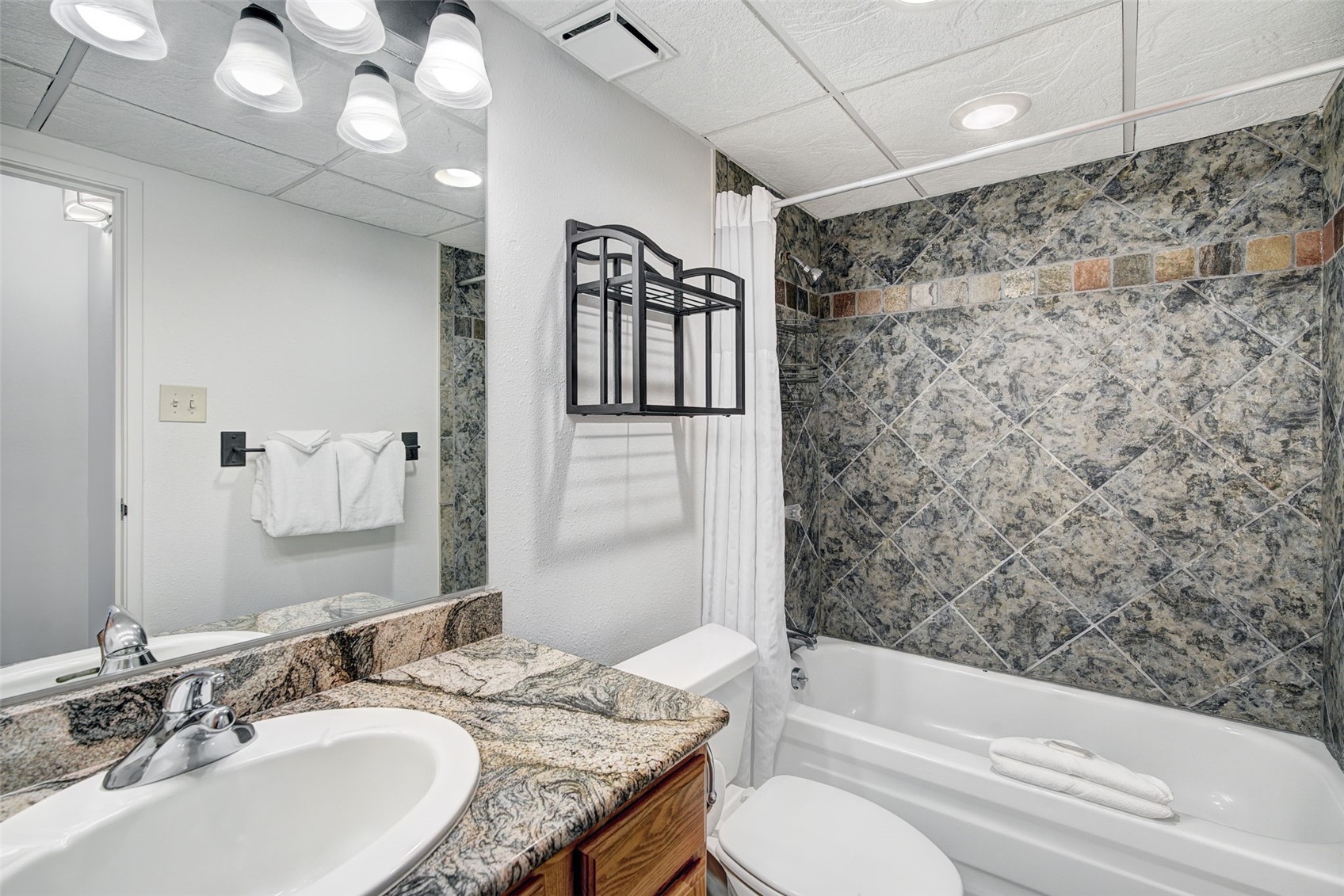 631 Village Road, Unit 31460 Breckenridge, CO 80424 - Photo 10 of 20 a bathroom with a granite countertop sink toilet and shower