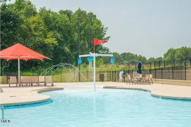 a view of a swimming pool with a patio