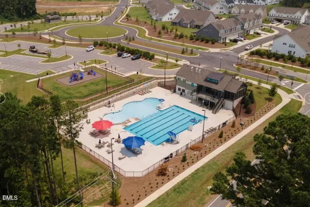 an aerial view of a house with a swimming pool