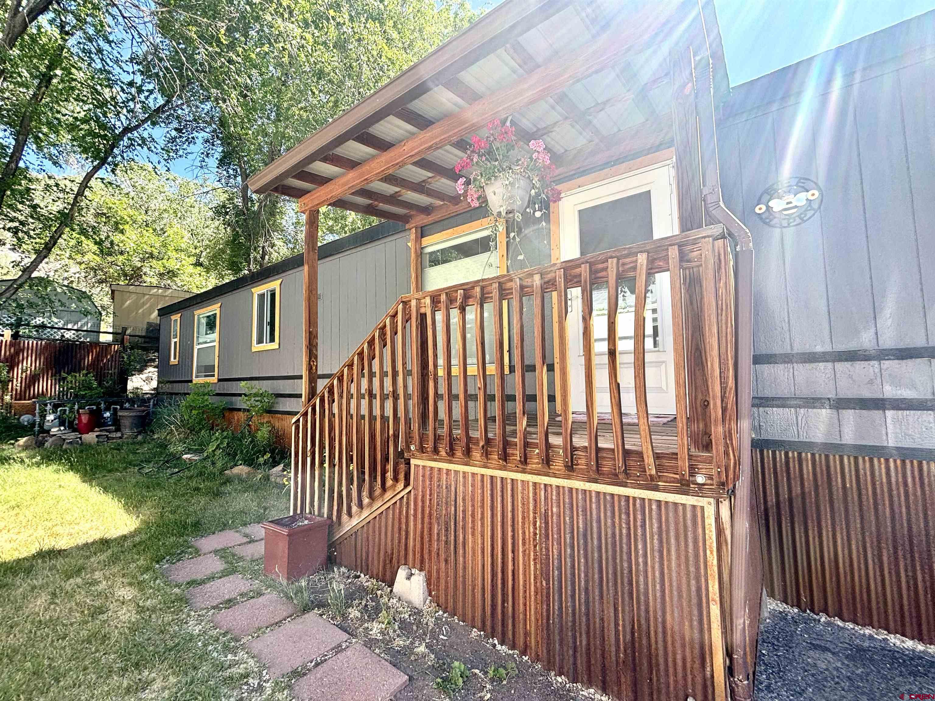 288 Animas View Drive, Unit 9 Durango, CO 81301 - Photo 1 of 16 a view of a house with a yard