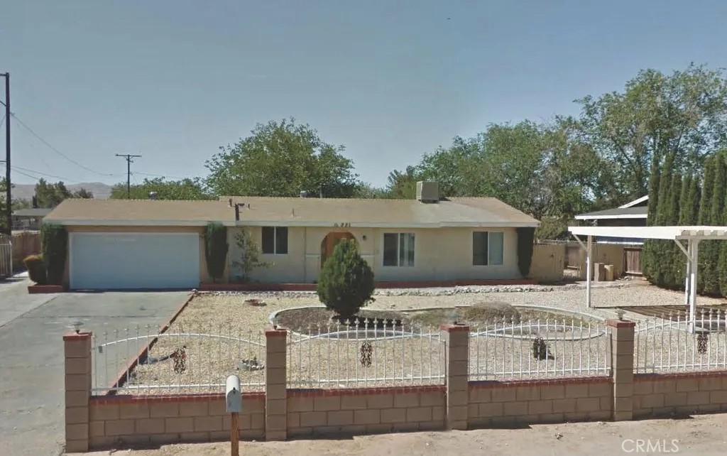 a front view of a house with yard