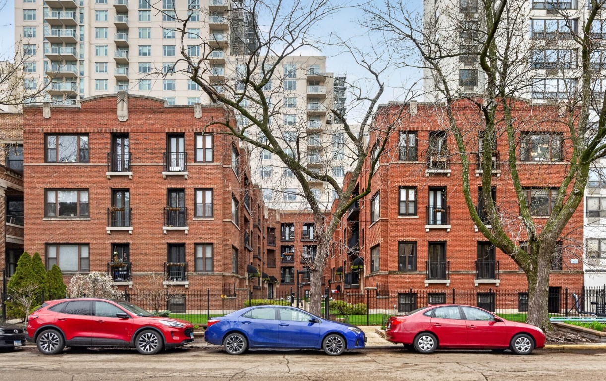 906 West Winona Street, Unit 2S Chicago, IL 60640 - Photo 1 of 15 a cars parked in front of a brick building