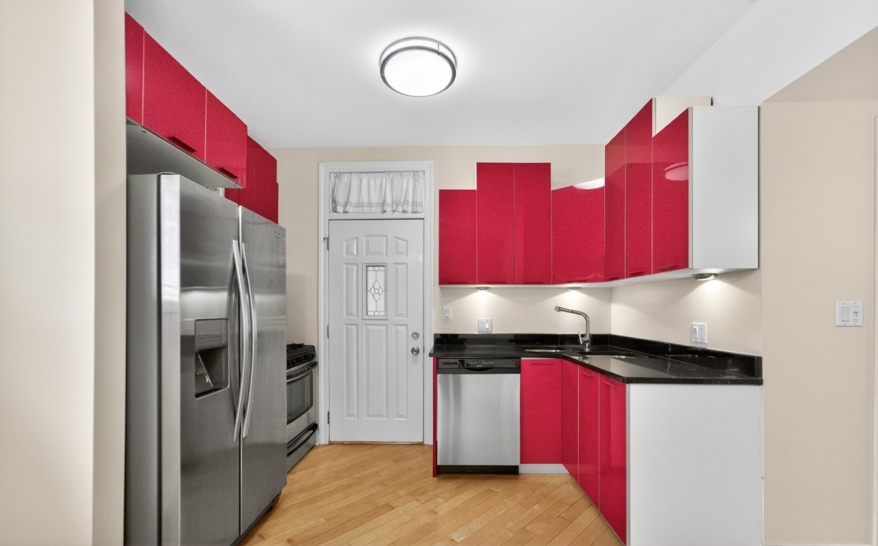 906 West Winona Street, Unit 2S Chicago, IL 60640 - Photo 4 of 15 a kitchen with a refrigerator a sink and cabinets