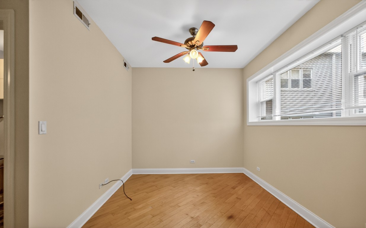 906 West Winona Street, Unit 2S Chicago, IL 60640 - Photo 8 of 15 a view of a room with a window and a ceiling fan