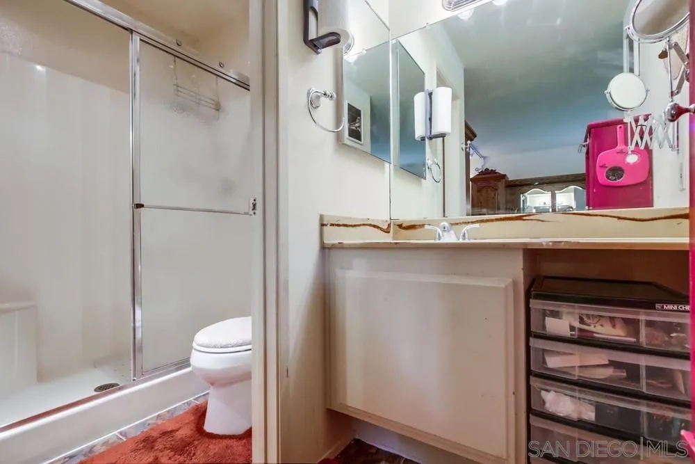 3583 Ruffin Road, Unit 209 San Diego, CA 92123 - Photo 17 of 39 a bathroom with a sink a toilet and shower
