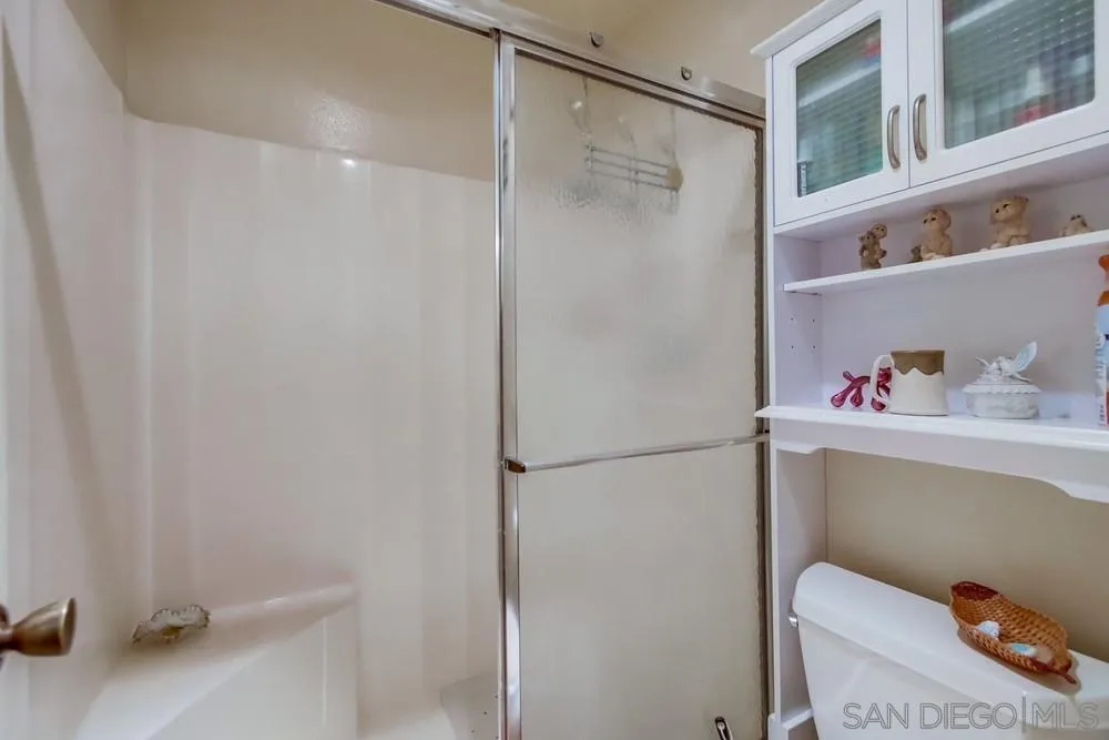3583 Ruffin Road, Unit 209 San Diego, CA 92123 - Photo 18 of 39 a bathroom with a shower and a sink