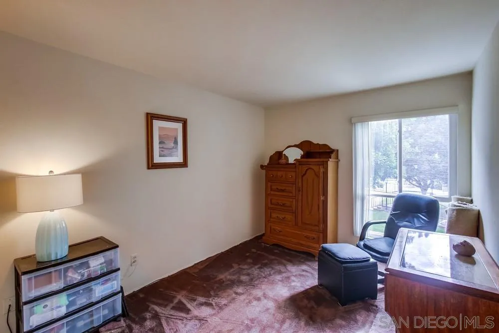 3583 Ruffin Road, Unit 209 San Diego, CA 92123 - Photo 20 of 39 a living room with furniture and wooden floor