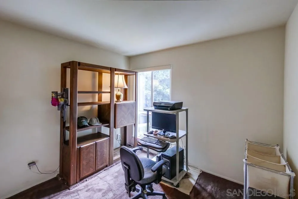 3583 Ruffin Road, Unit 209 San Diego, CA 92123 - Photo 21 of 39 a view of a workspace with furniture and a window