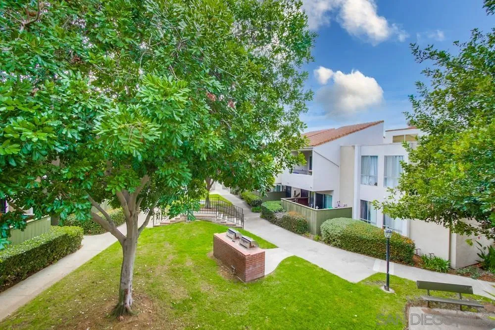 3583 Ruffin Road, Unit 209 San Diego, CA 92123 - Photo 26 of 39 a front view of a house with garden