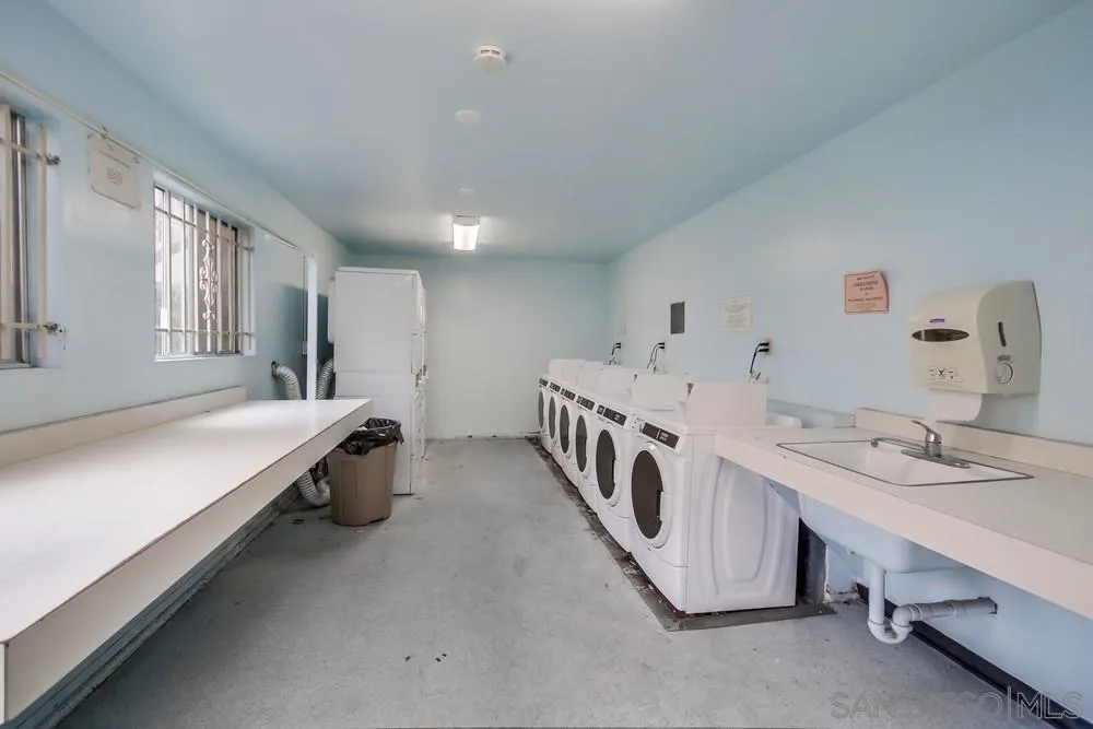 3583 Ruffin Road, Unit 209 San Diego, CA 92123 - Photo 31 of 39 a large white room with two washing machine