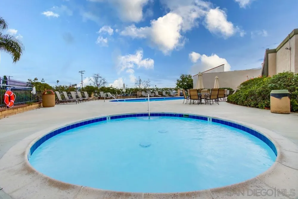 3583 Ruffin Road, Unit 209 San Diego, CA 92123 - Photo 34 of 39 a view of a swimming pool with outdoor seating