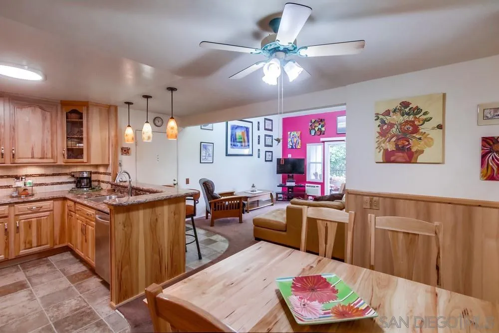 3583 Ruffin Road, Unit 209 San Diego, CA 92123 - Photo 10 of 39 a kitchen with stainless steel appliances granite countertop a sink dishwasher stove and cabinets with wooden floor