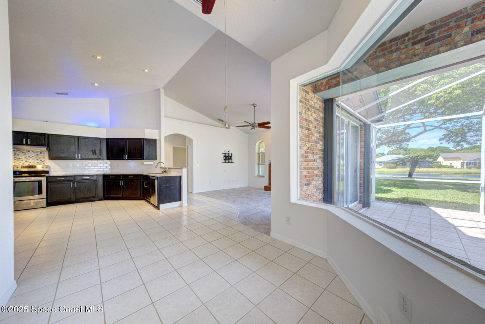4065 Sand Ridge Drive Merritt Island, FL 32953 - Photo 11 of 59 a large white kitchen with a large window