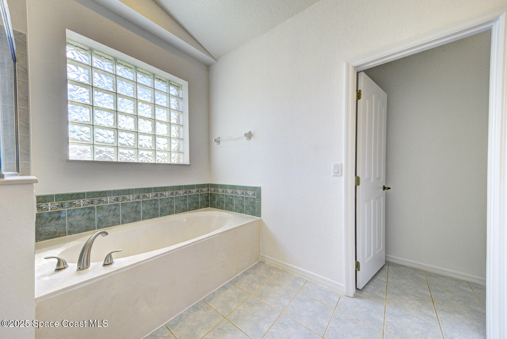 4065 Sand Ridge Drive Merritt Island, FL 32953 - Photo 24 of 59 a bathroom with a bathtub and a shower