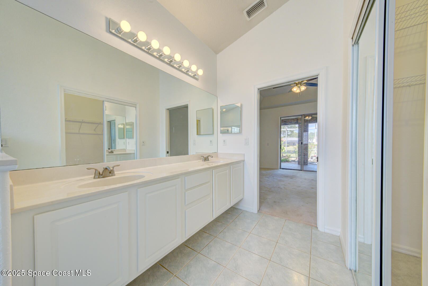 4065 Sand Ridge Drive Merritt Island, FL 32953 - Photo 25 of 59 a spacious bathroom with a double vanity sink and a mirror