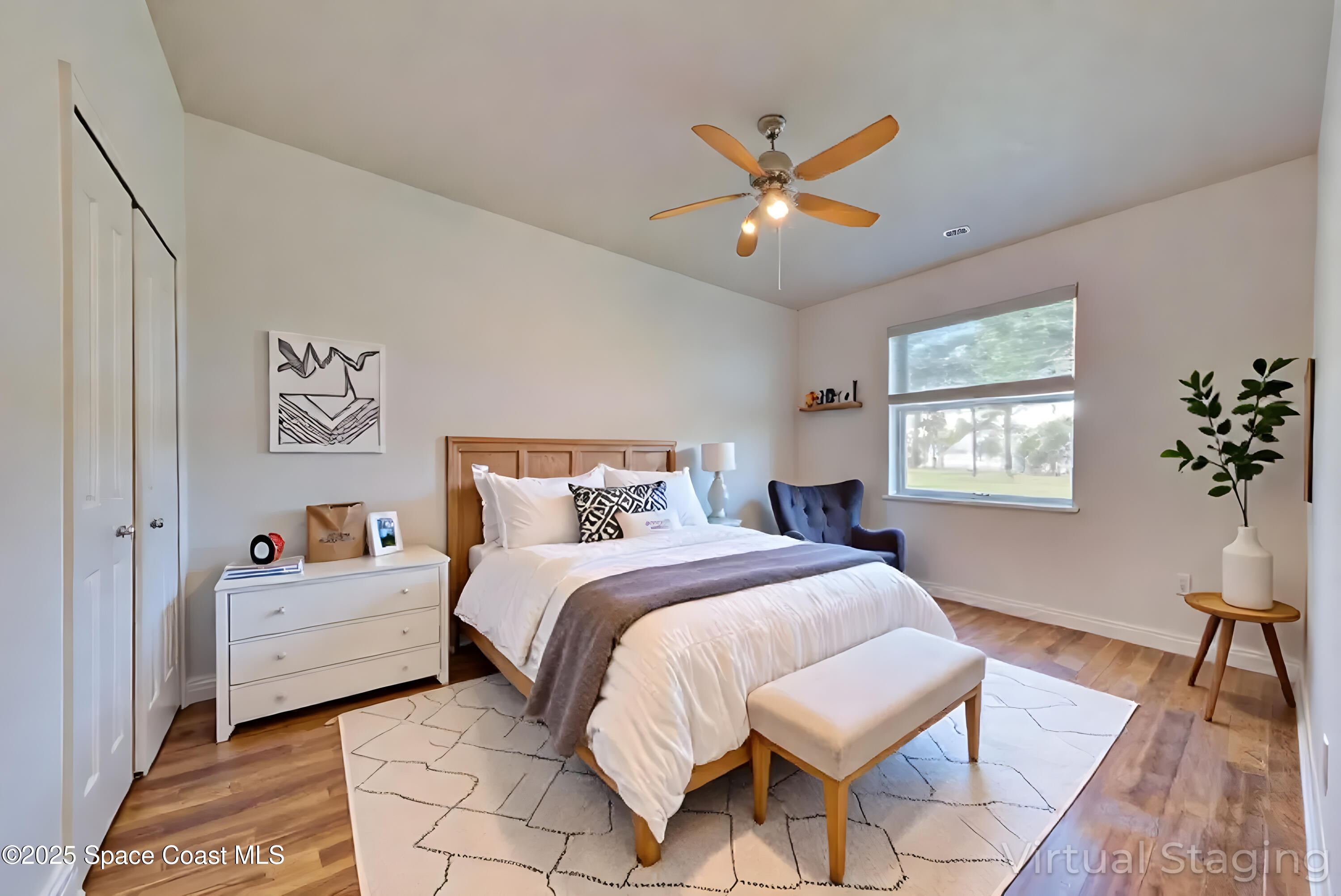 4065 Sand Ridge Drive Merritt Island, FL 32953 - Photo 27 of 59 a bedroom with a bed and a chandelier