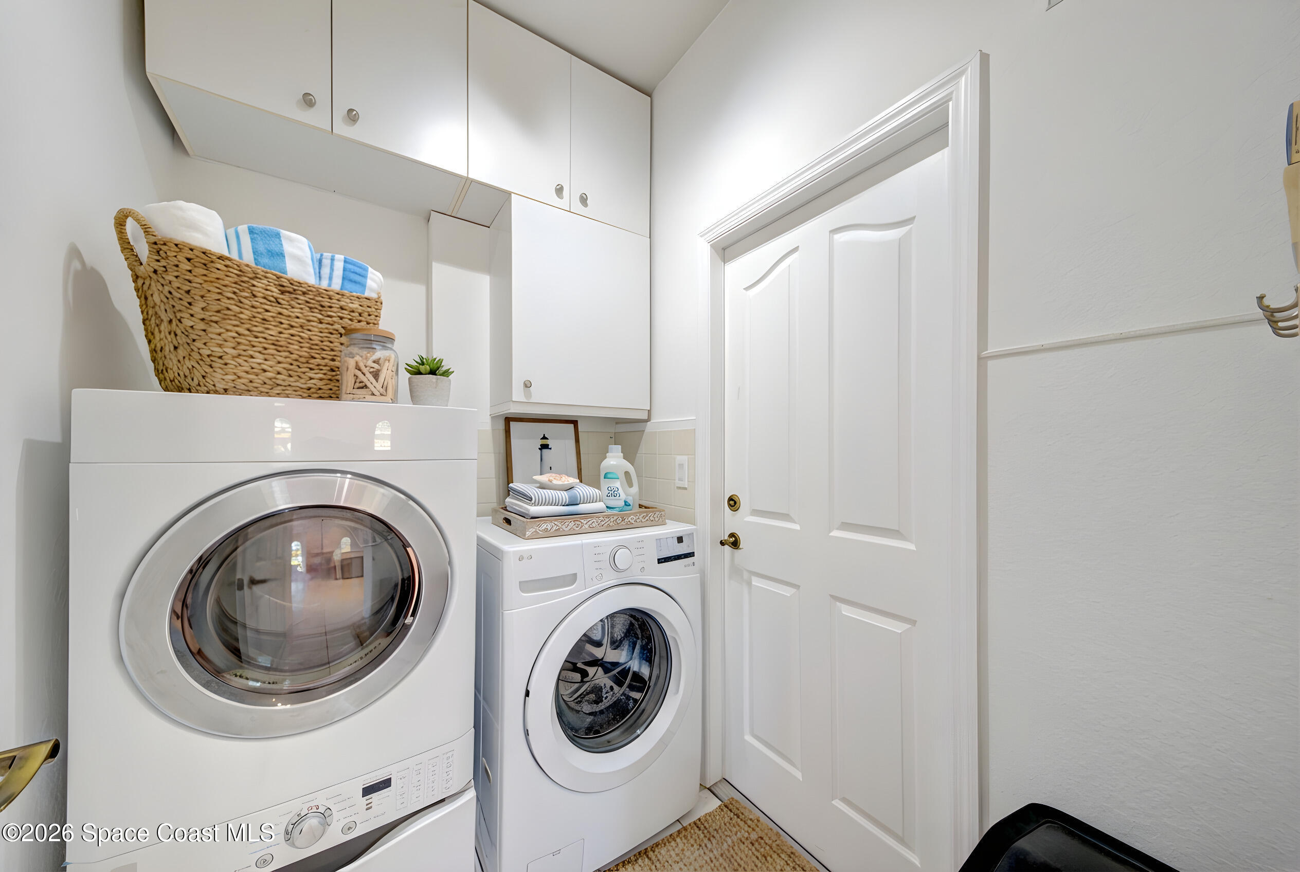 4065 Sand Ridge Drive Merritt Island, FL 32953 - Photo 34 of 59 a utility room with dryer and washer