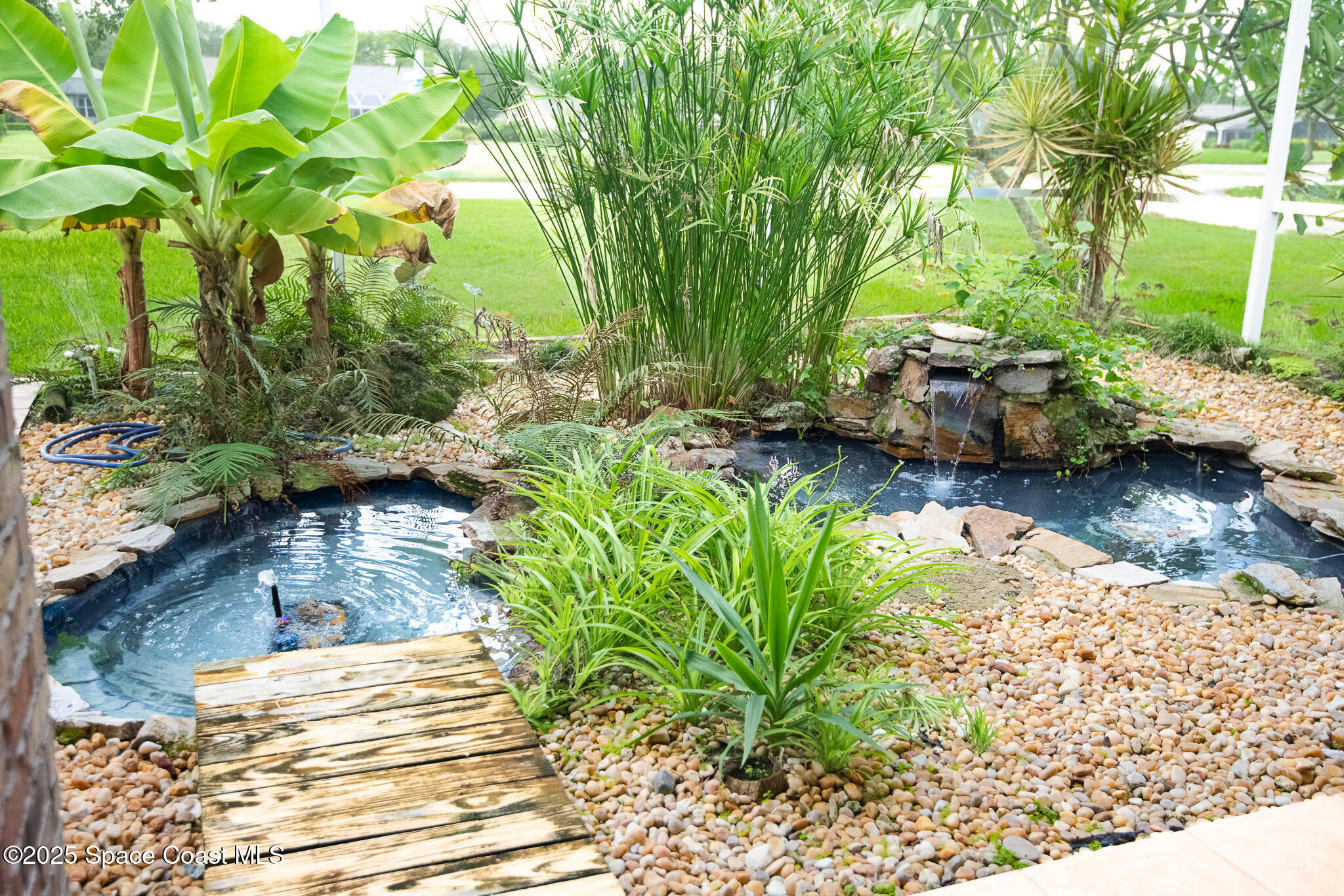 4065 Sand Ridge Drive Merritt Island, FL 32953 - Photo 35 of 59 a view of a lake with large trees