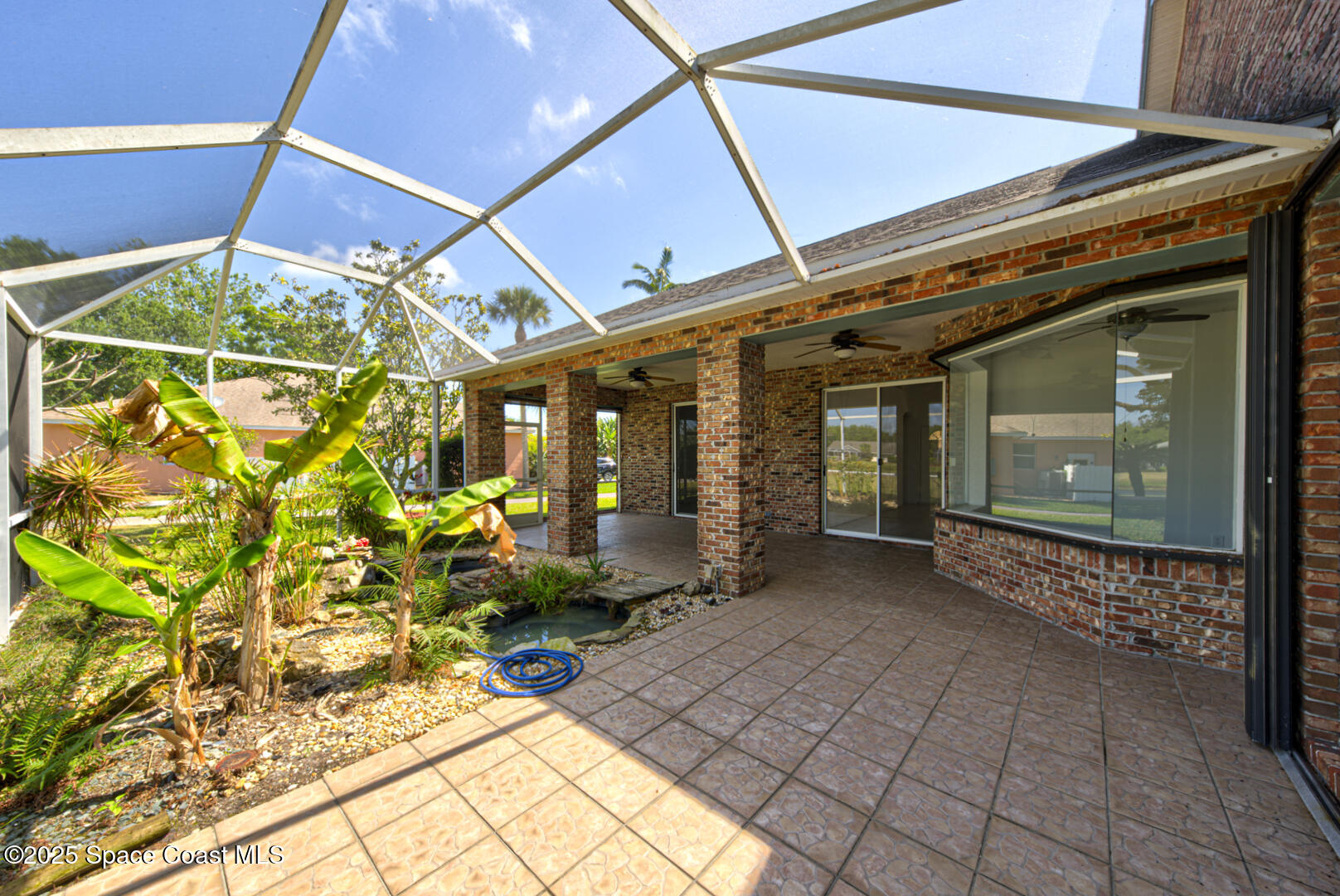 4065 Sand Ridge Drive Merritt Island, FL 32953 - Photo 40 of 59 a front view of a house with outdoor seating