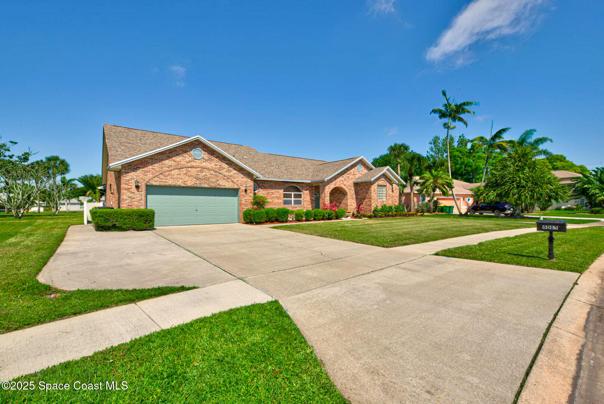 4065 Sand Ridge Drive Merritt Island, FL 32953 - Photo 4 of 59 a front view of a house with a yard