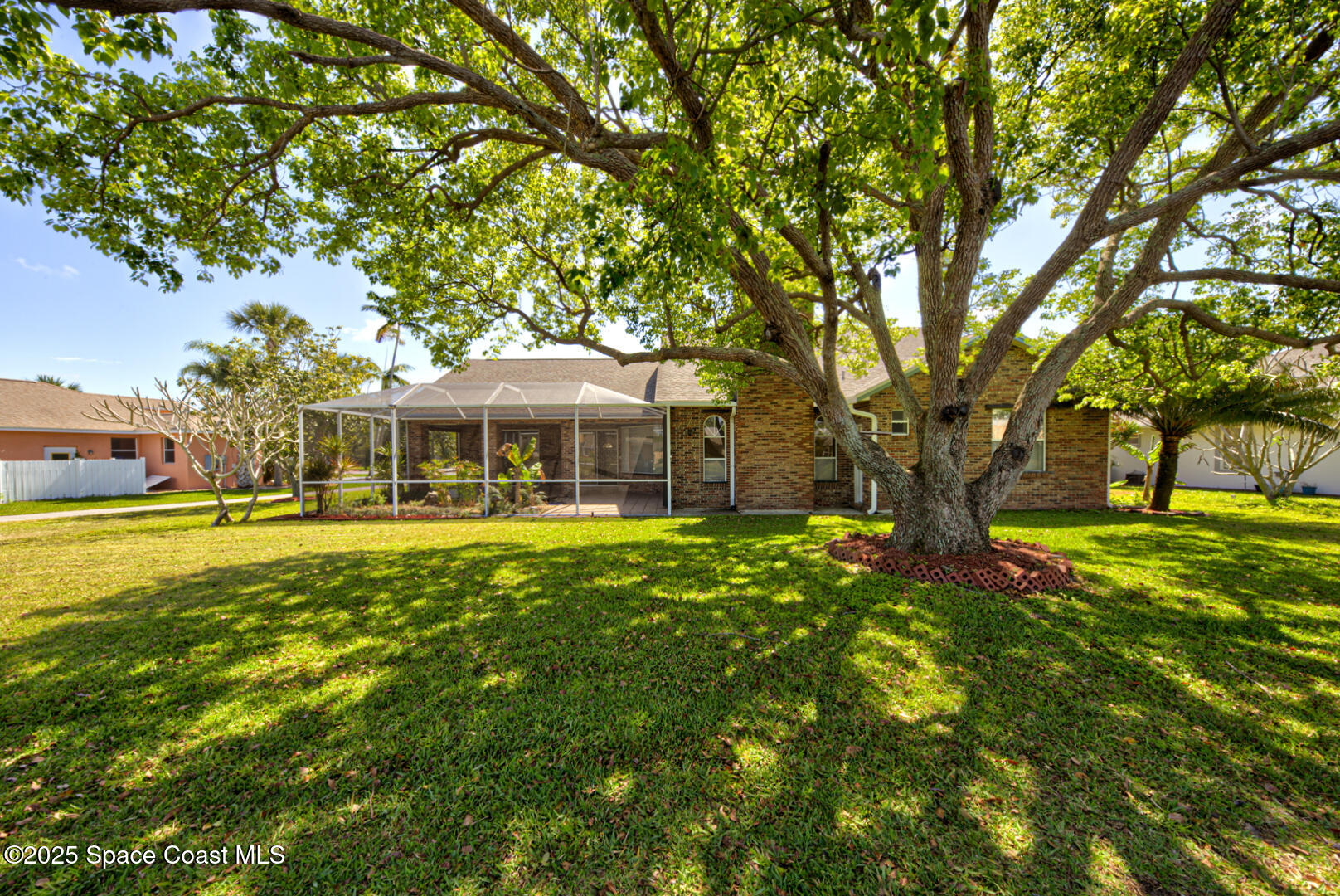 4065 Sand Ridge Drive Merritt Island, FL 32953 - Photo 42 of 59 a front view of a house with yard and green space