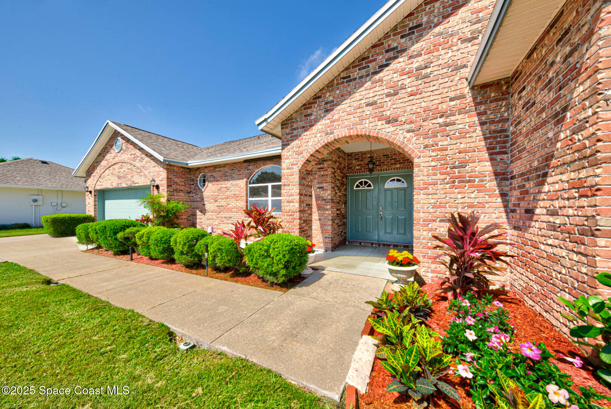 4065 Sand Ridge Drive Merritt Island, FL 32953 - Photo 5 of 59 a front view of a house with a yard