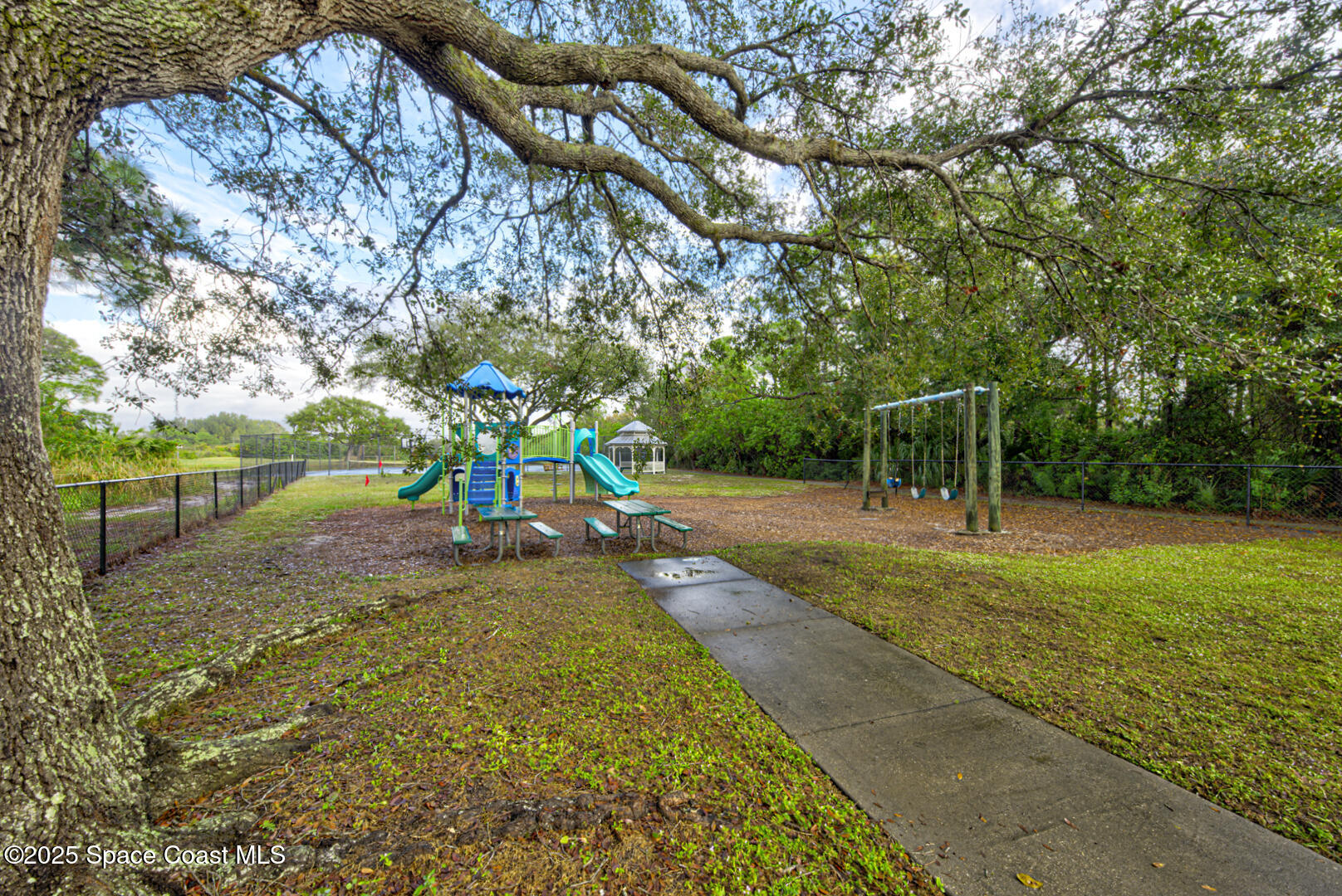 4065 Sand Ridge Drive Merritt Island, FL 32953 - Photo 58 of 59 a view of a park with large trees